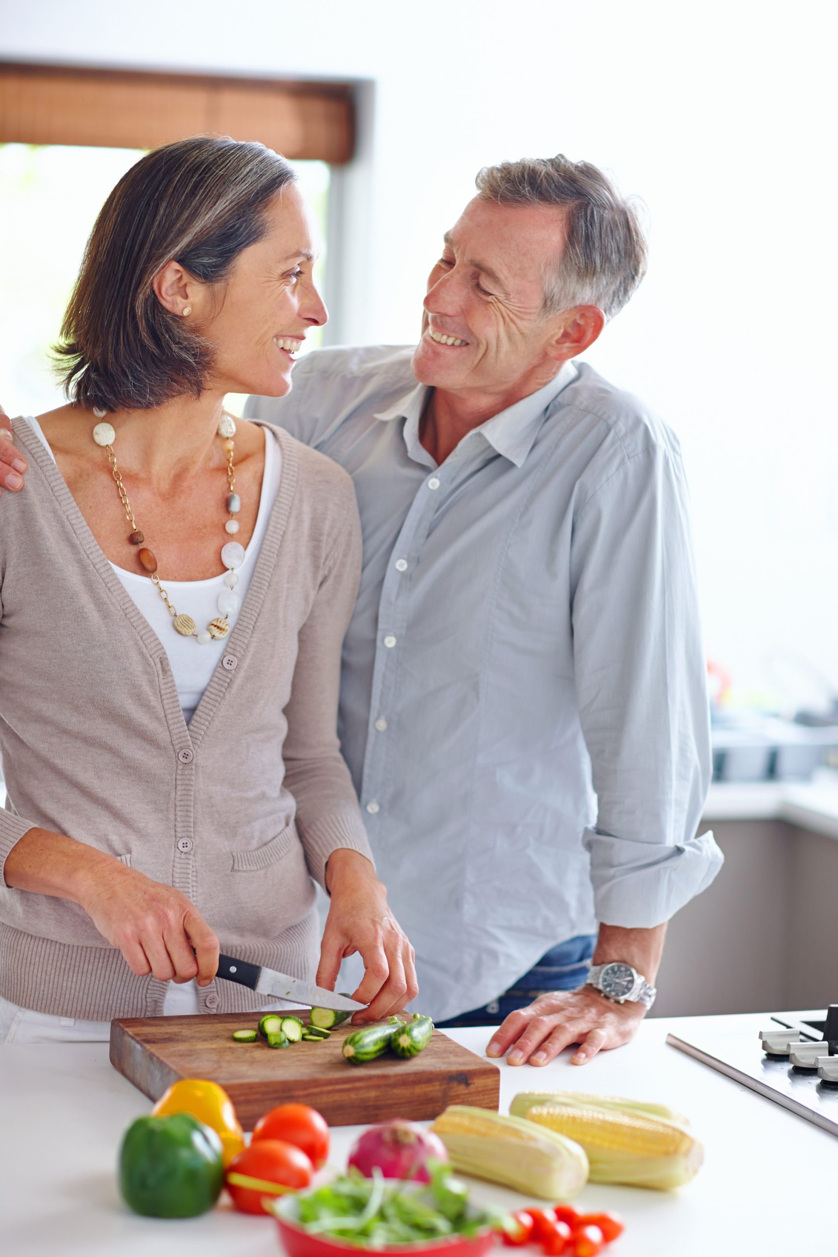Doctor talking with an older couple during a consultation.